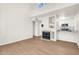 Bright living room featuring a fireplace, open floor plan, and modern finishes at 1126 W Elliot Rd # 2023, Chandler, AZ 85224
