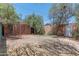 Spacious backyard surrounded by mature trees and decorative fencing provides privacy and shade at 1134 W Portland St, Phoenix, AZ 85007