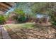 Backyard with mature trees, grass lawn, patio and an outdoor dining set at 1134 W Portland St, Phoenix, AZ 85007