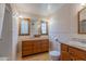 Bathroom with patterned wallpaper, vanity with tile countertop, and wood trim at 1134 W Portland St, Phoenix, AZ 85007