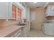 Functional kitchen featuring classic cabinetry and a neutral-toned color palette at 1134 W Portland St, Phoenix, AZ 85007