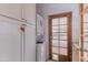 Convenient laundry room with stacked washer/dryer and built-in storage cabinets at 1134 W Portland St, Phoenix, AZ 85007