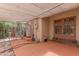 Covered patio area with lattice ceiling, outdoor access, and painted concrete floor at 1134 W Portland St, Phoenix, AZ 85007