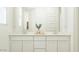 Bright bathroom with a double vanity, plenty of storage, and clean, white finishes at 11952 W Calle De Pompas --, Peoria, AZ 85383