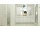 Bright and modern bathroom with dual sinks, white cabinets, and a glass-enclosed shower at 11952 W Calle De Pompas --, Peoria, AZ 85383