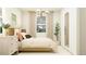 Well-lit bedroom featuring light hardwood floors, a dresser, and stylish decor at 11952 W Calle De Pompas --, Peoria, AZ 85383