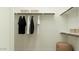 Organized walk-in closet with hanging clothes and shelving at 11952 W Calle De Pompas --, Peoria, AZ 85383