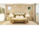 Comfortable bedroom featuring lamps, nightstands, bench and natural light at 11952 W Calle De Pompas --, Peoria, AZ 85383