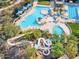 Resort-style pool area with water slide, various pools, umbrellas, and landscaping at 12118 W Dove Wing Way, Peoria, AZ 85383