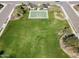 Basketball court and grassy fields for the community at 12118 W Dove Wing Way, Peoria, AZ 85383