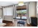 Bright dining area offering a view of backyard with patio and play area through large sliding glass doors at 12118 W Dove Wing Way, Peoria, AZ 85383