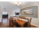 Inviting dining room with hardwood floors, stylish lighting, and decorative accent wall at 12118 W Dove Wing Way, Peoria, AZ 85383