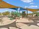 Playground with multiple slides, climbing structures, and swings at 12118 W Dove Wing Way, Peoria, AZ 85383