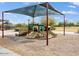 Community playground with multiple slides, climbing structures, and shade at 12118 W Dove Wing Way, Peoria, AZ 85383