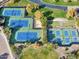 Aerial view of tennis and pickle ball courts surrounded by green space at 12118 W Dove Wing Way, Peoria, AZ 85383