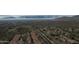 Breathtaking aerial view of the desert community nestled in a stunning natural landscape with distant mountain ranges at 136 E Desert Wind Dr, Phoenix, AZ 85048