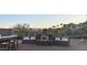 Outdoor living space complete with bar seating and built in fire pit and bench seating at 136 E Desert Wind Dr, Phoenix, AZ 85048