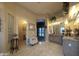 Bathroom features tiled floor, vanity, and access to another room with decorative chair at 136 E Desert Wind Dr, Phoenix, AZ 85048