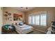 Comfortable bedroom with a full bed, decorative pillows, and plantation shutters to let the light in at 136 E Desert Wind Dr, Phoenix, AZ 85048