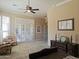 Bright bedroom with large windows, plantation shutters, and classic furniture for a peaceful retreat at 136 E Desert Wind Dr, Phoenix, AZ 85048