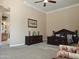 Bedroom boasts classic furnishings and decor, with a dresser, decorative candles, and view of the bathroom at 136 E Desert Wind Dr, Phoenix, AZ 85048