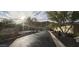 Street view of the Whistling Rock community entrance with desert landscaping and mountain views at 136 E Desert Wind Dr, Phoenix, AZ 85048