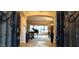 Elegant foyer with a grand piano, ornate decor, and natural light, creating a sophisticated and inviting entrance at 136 E Desert Wind Dr, Phoenix, AZ 85048