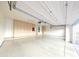 Spacious garage with ample storage cabinets and a clean, epoxy-coated floor at 136 E Desert Wind Dr, Phoenix, AZ 85048