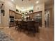 A modern kitchen with stainless steel appliances, a center island with bar stools, and ample cabinet space at 136 E Desert Wind Dr, Phoenix, AZ 85048