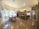 Spacious kitchen with stainless steel appliances, a central island, and an adjacent dining area with ample natural light at 136 E Desert Wind Dr, Phoenix, AZ 85048