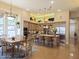 Open kitchen featuring stainless steel appliances, a central island, and seamless connection to the dining area at 136 E Desert Wind Dr, Phoenix, AZ 85048