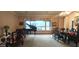 A well-lit living room featuring a piano, ornate furniture, and a large window offering outdoor views at 136 E Desert Wind Dr, Phoenix, AZ 85048