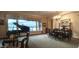 A bright living room featuring a piano, ornate furniture, and large windows providing natural light and view at 136 E Desert Wind Dr, Phoenix, AZ 85048