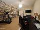 Home office with custom bookshelves, neutral paint, desk area, and laminate wood flooring at 136 E Desert Wind Dr, Phoenix, AZ 85048