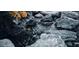 Close up of backyard water feature with running water and small rocks, perfect for a peaceful landscape background at 136 E Desert Wind Dr, Phoenix, AZ 85048
