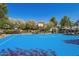 Community basketball court surrounded by lush landscaping offers a scenic space for residents to play basketball within the community at 14180 W Willow Ave, Surprise, AZ 85379