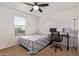 Bedroom with a desk, computer monitors, a window, and a bed at 14180 W Willow Ave, Surprise, AZ 85379