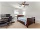 Bedroom with a desk, computer monitors, a window, and a bed at 14180 W Willow Ave, Surprise, AZ 85379