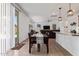 Bright dining area with sliding glass doors, adjacent to the kitchen and living room for open-concept living at 14180 W Willow Ave, Surprise, AZ 85379