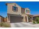 This is a charming two-story home featuring neutral stucco, a two-car garage, and a well-manicured front yard at 14180 W Willow Ave, Surprise, AZ 85379