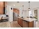 Well-equipped kitchen with granite countertops, stainless steel appliances, and a view to the dining area at 14180 W Willow Ave, Surprise, AZ 85379