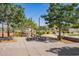 Outdoor picnic area provides a communal space for gatherings, with tables, seating, barbecue grills, and lush landscaping at 14180 W Willow Ave, Surprise, AZ 85379