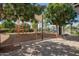 Community playground with colorful play structures, shaded seating, and landscaped surroundings, perfect for families at 14180 W Willow Ave, Surprise, AZ 85379
