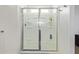 Shower stall with glass doors and built-in shelving at 14180 W Willow Ave, Surprise, AZ 85379