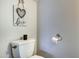 Cozy half-bathroom with a decorative heart sign, and toilet paper roll at 14404 N Boxwood Ln, Fountain Hills, AZ 85268
