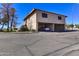 View of the multi-level home showing street view and covered parking at 14404 N Boxwood Ln, Fountain Hills, AZ 85268