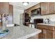 Well-equipped kitchen featuring granite countertops and stainless steel appliances at 14404 N Boxwood Ln, Fountain Hills, AZ 85268