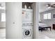 Efficient laundry area featuring a stacked washer and dryer conveniently located near the bedroom at 14404 N Boxwood Ln, Fountain Hills, AZ 85268