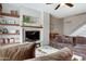Relaxing living room featuring built-in shelving, a ceiling fan, and plenty of comfortable seating at 14404 N Boxwood Ln, Fountain Hills, AZ 85268