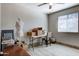 Well-lit room with neutral walls, tile floor, and a sewing table near a window at 14404 N Boxwood Ln, Fountain Hills, AZ 85268